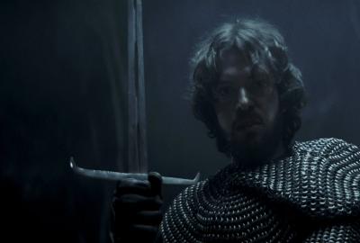 A knight holds a sword