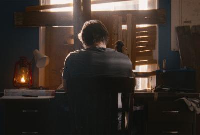 A man sits at a desk