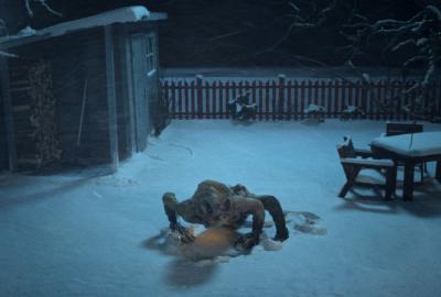 A creature crawls in the snow