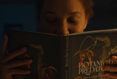 Hannah smells a library book