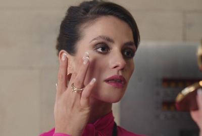 Sinister receptionist Patti Enmark checks her reflection