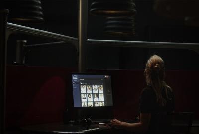 A woman works on her computer
