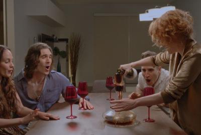 Friends having fun drinking at a dinner party.