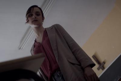 Maria the teacher looks down