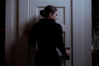 Woman opens door