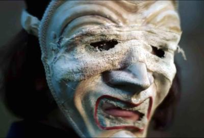 A creepy masked person