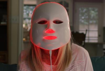 Facelift film still woman with plastic face mask