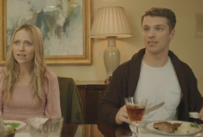 A young couple at the dinner table.