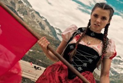 Mad Heidi holds a flag