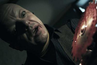 On Air (Radio Silence) man with circular saw coming towards his head