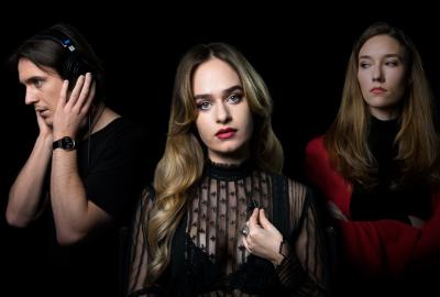 The Junket film still two women and a man with headphones